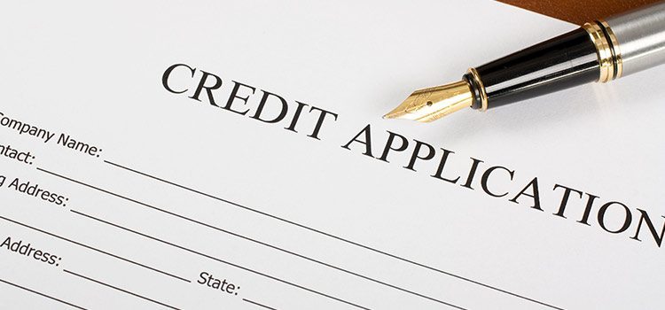 Agiliti Credit Application document with pen