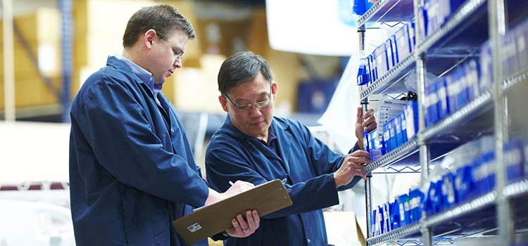 Two biomed techs conducting an equipment inventory