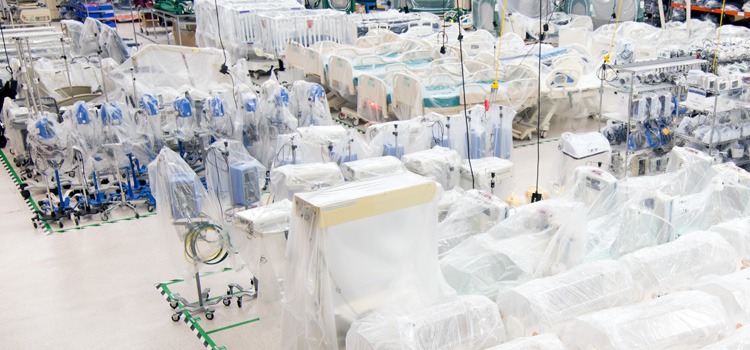 Assorted medical equipment in warehouse - incubators, beds, infusion