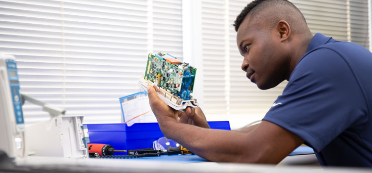 A B-MET inspects and repairs internal components of medical equipment