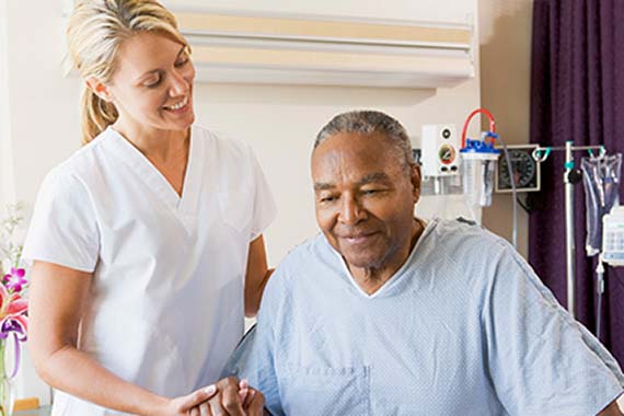 nurse assisting patient